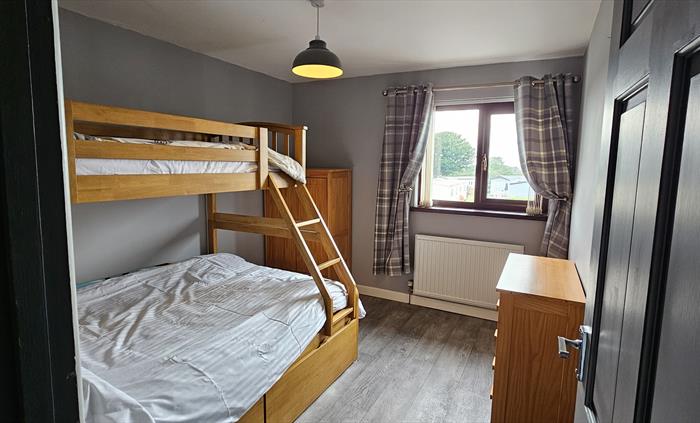 The Redford Cwtch Lounge – a cosy, welcoming space with soft seating, warm lighting, and rustic charm, perfect for relaxing with family or friends aft